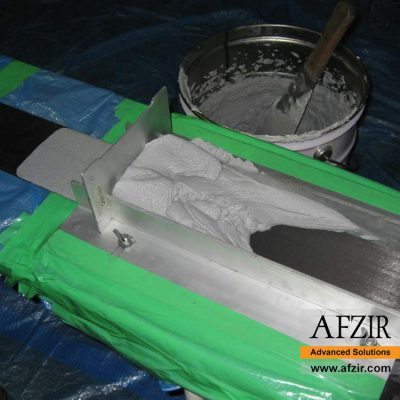 carbon fiber laminate saturation with epoxy adhesive - Afzir Retrofitting Co.